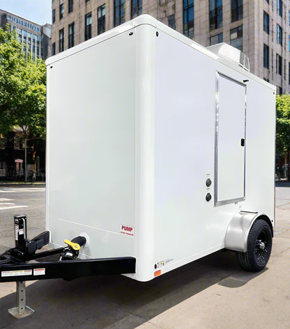 2 stall mini restroom trailer on a city street